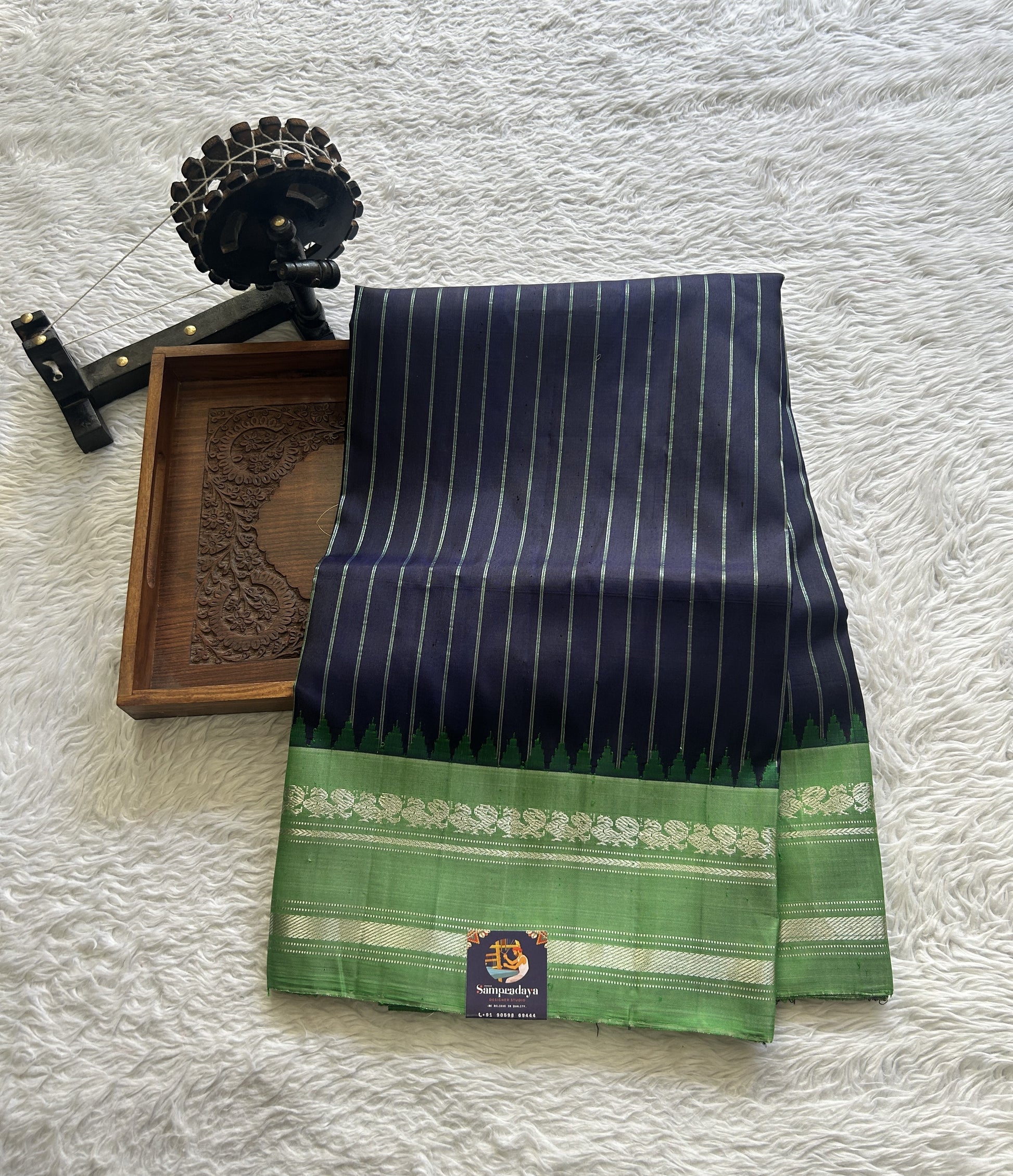 Gadwal Pattu Saree Navy Blue Colored Complemented With a Green Color Zari Gap Border - Sampradaya Designer Studio
