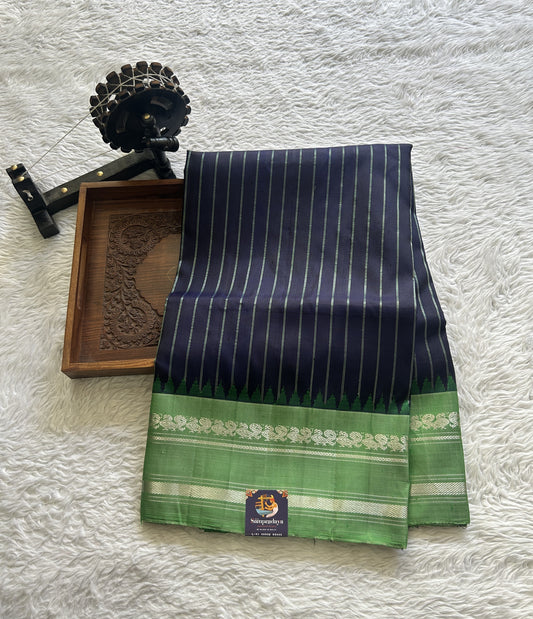 Gadwal Pattu Saree Navy Blue Colored Complemented With a Green Color Zari Gap Border - Sampradaya Designer Studio