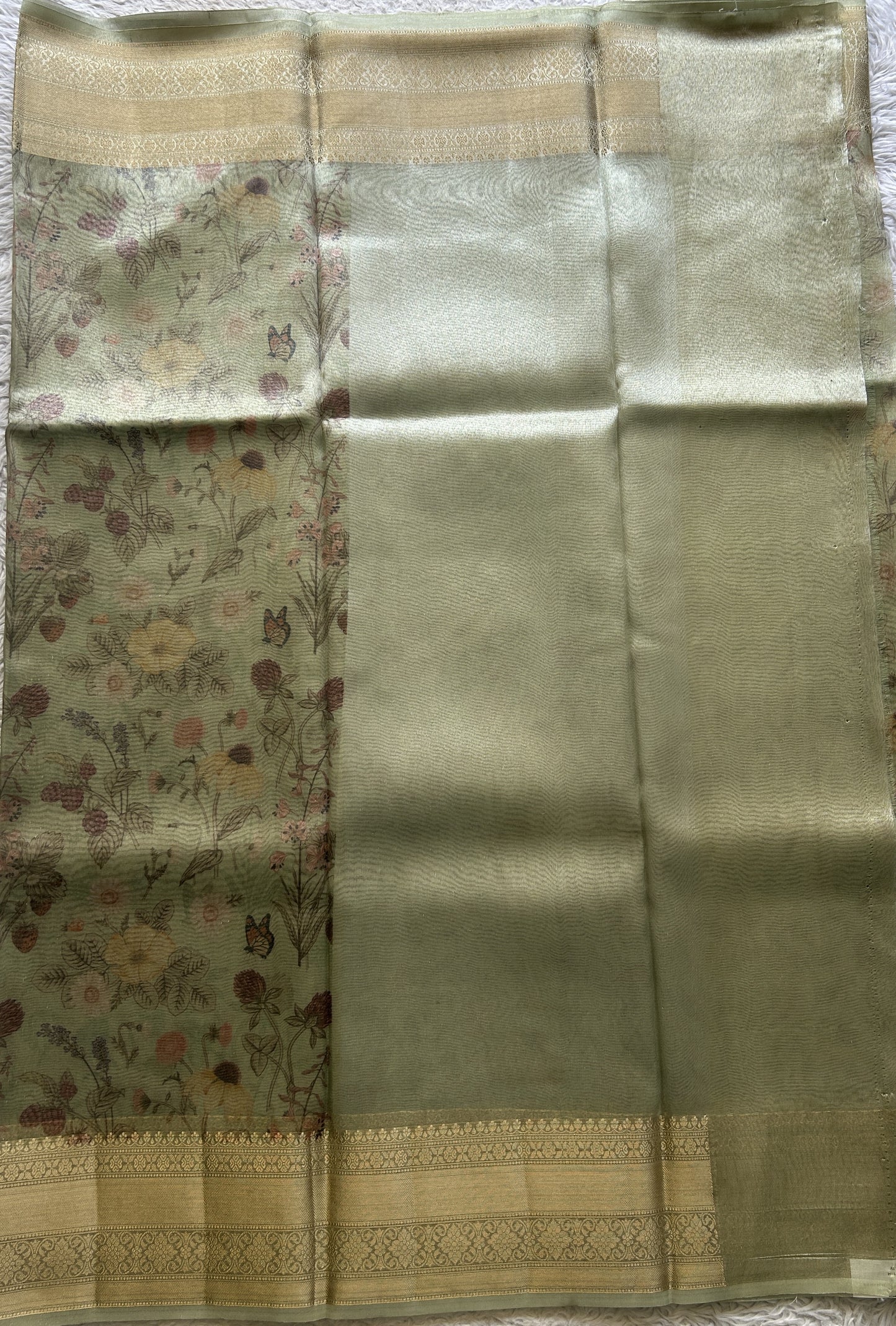 Tissue Organza Saree Light Green Colored Elegantly Paired with a Zari Border. - Sampradaya Designer Studio