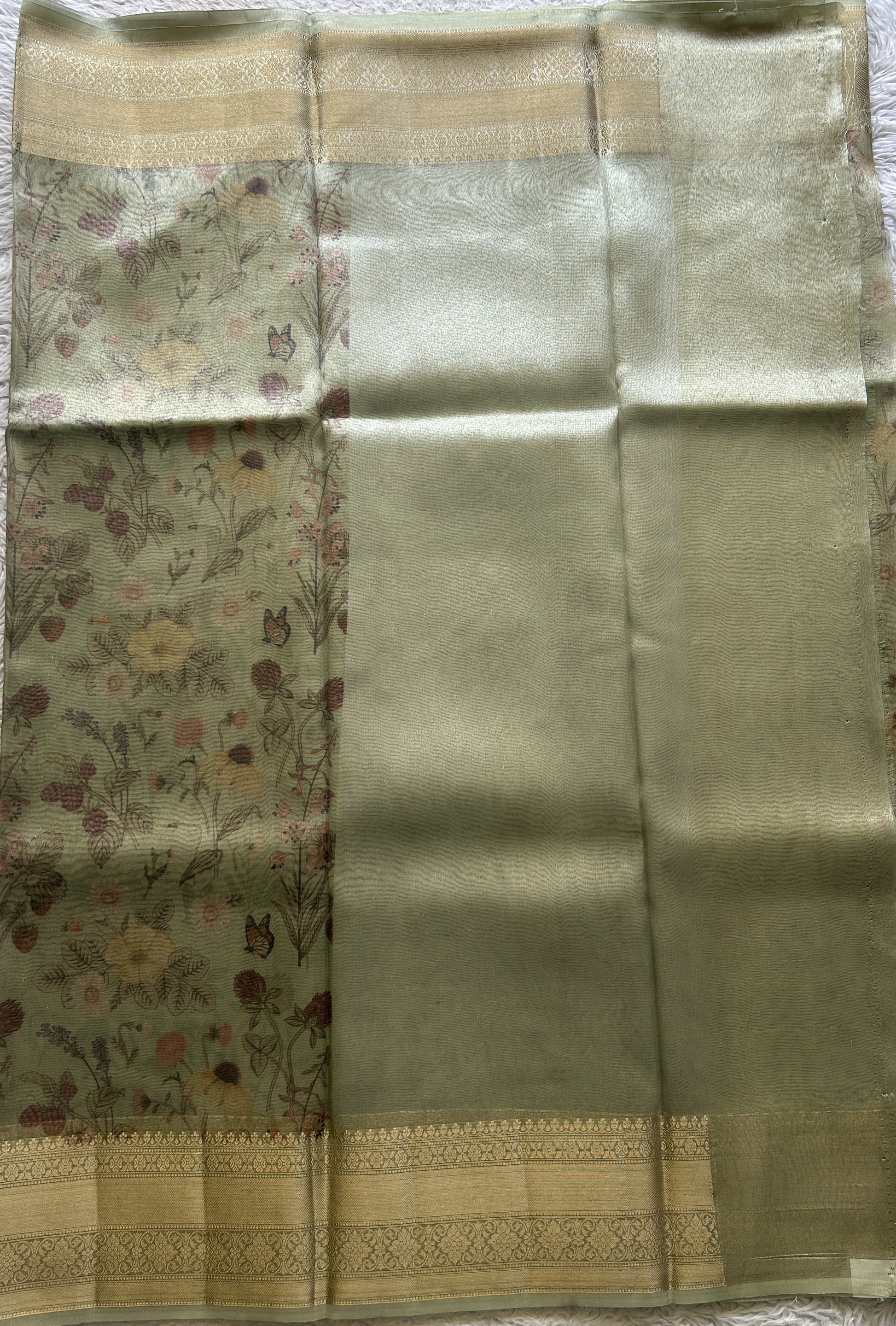 Tissue Organza Saree Light Green Colored Elegantly Paired with a Zari Border. - Sampradaya Designer Studio