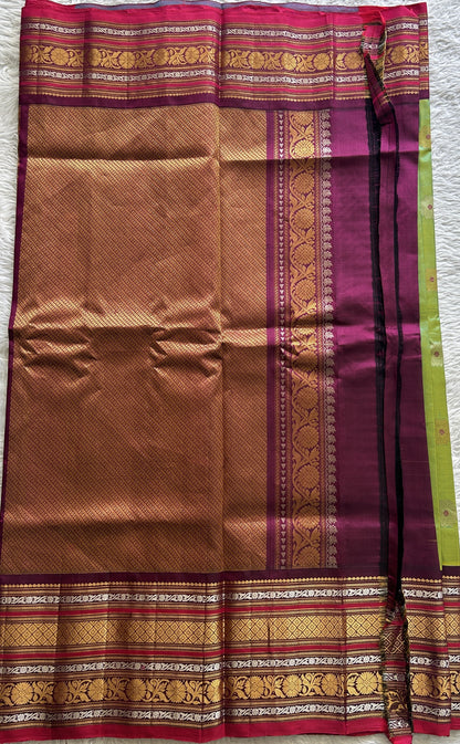 Gadwal Pattu Saree Green Colored Complemented With a Dark Pink Color Zari Border - Sampradaya Designer Studio