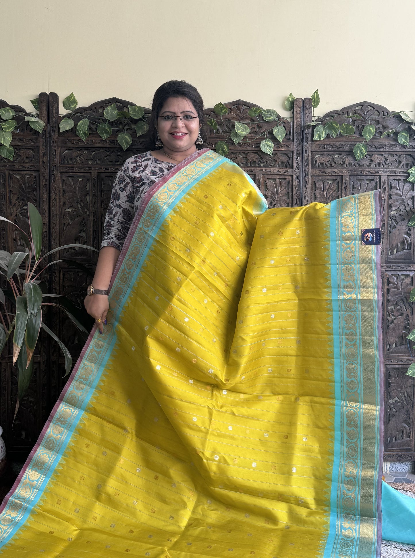 Gadwal Silk Saree Yellow Colored Complemented With a Kanchi Border - Sampradaya Designer Studio