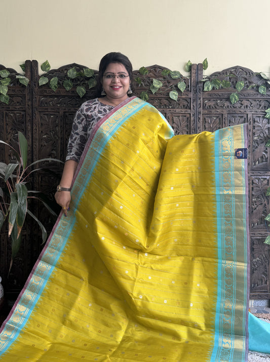 Gadwal Silk Saree Yellow Colored Complemented With a Kanchi Border - Sampradaya Designer Studio