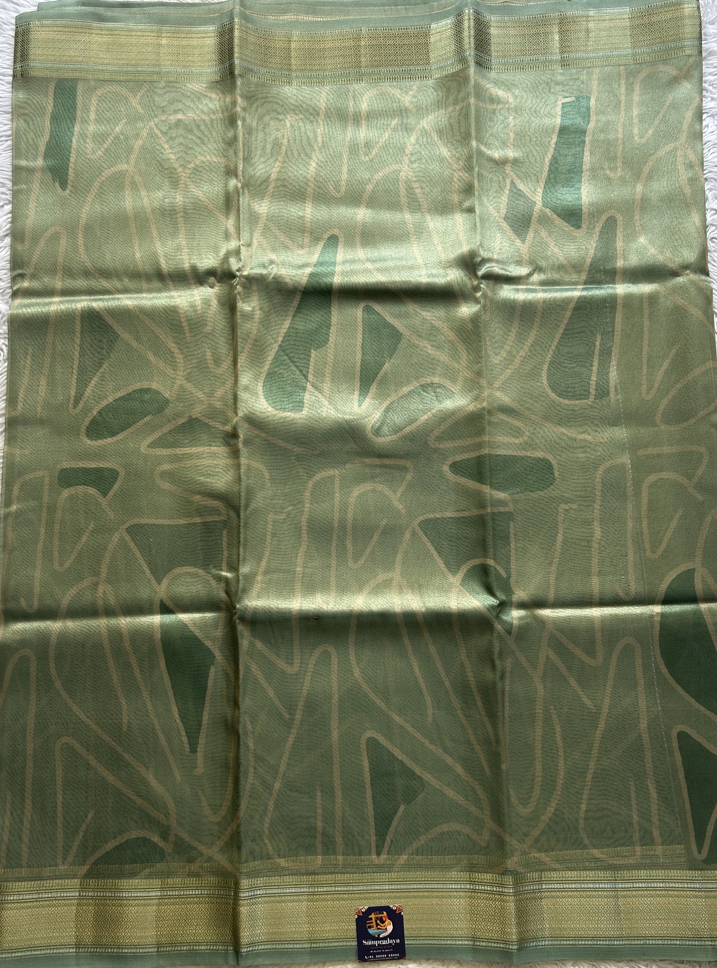 Tissue Organza Saree Light Sea Green Colored Elegantly Paired with a Zari Border. - Sampradaya Designer Studio