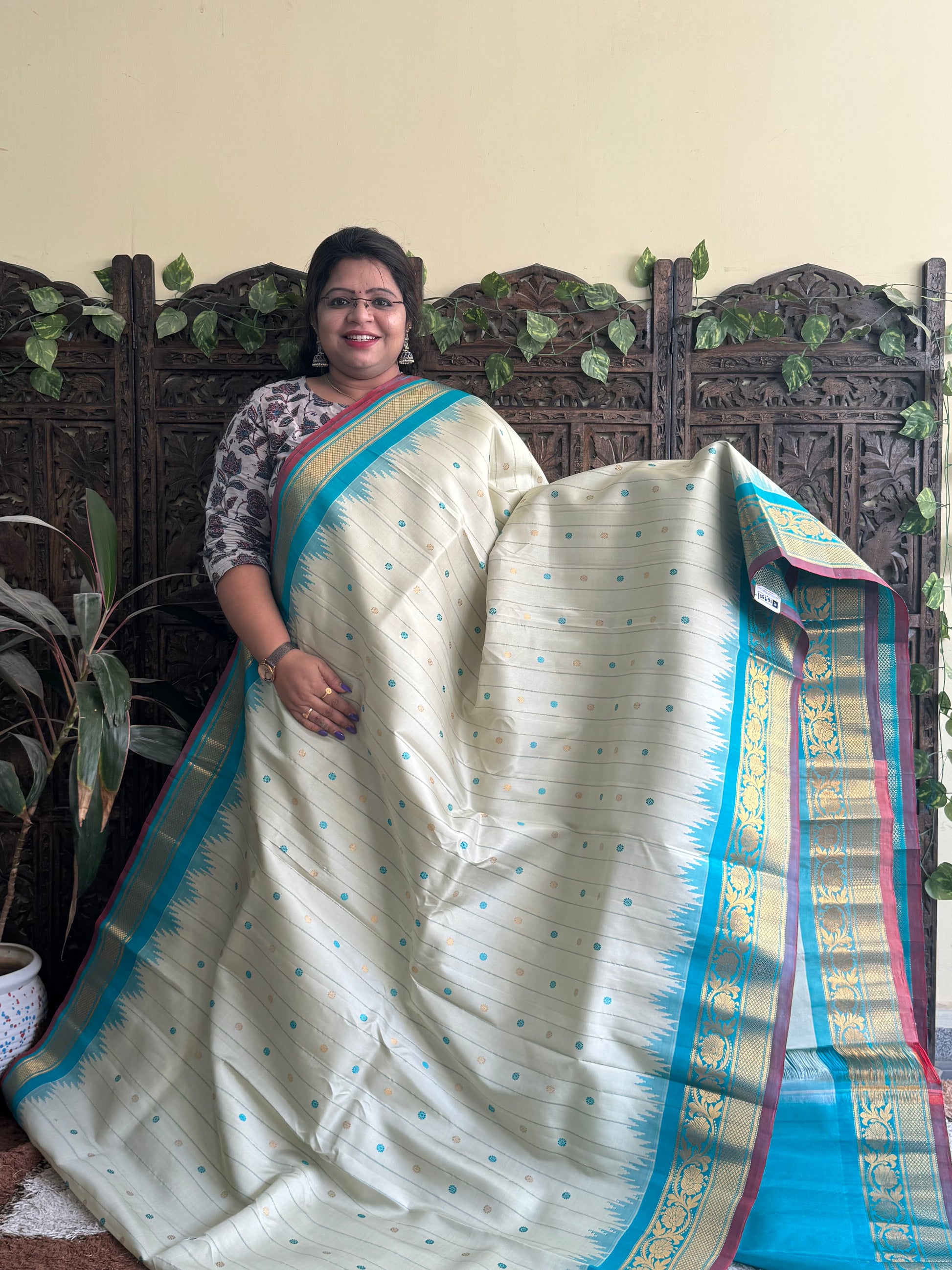 Gadwal Silk Saree Cream Colored Complemented With a Sea Blue Kanchi Border - Sampradaya Designer Studio