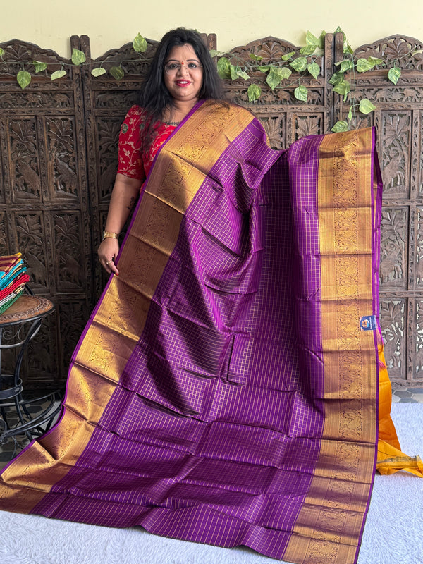 Pure Kanjivaram Silk Saree Deep Violet Colored Elegantly Paid with a Gold Zari Border. - Sampradaya Designer Studio