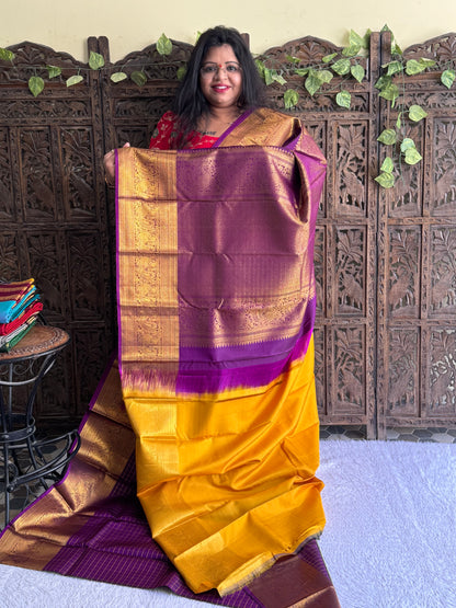 Pure Kanjivaram Silk Saree Deep Violet Colored Elegantly Paid with a Gold Zari Border.
