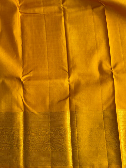 Pure Kanjivaram Silk Saree Deep Violet Colored Elegantly Paid with a Gold Zari Border.