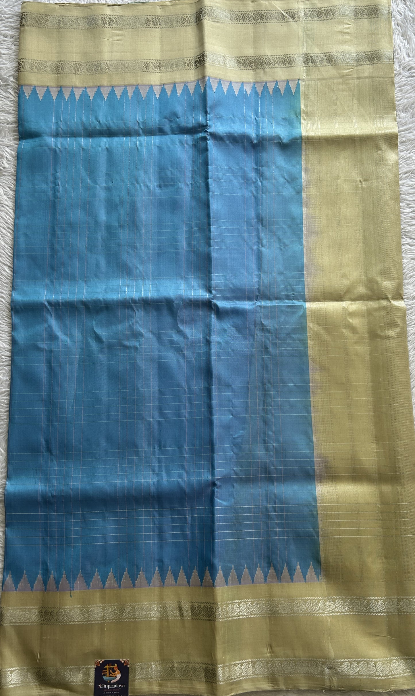 Gadwal Pattu Saree Sky Blue Colored Complemented With a Yellow Color Zari Gap Border - Sampradaya Designer Studio