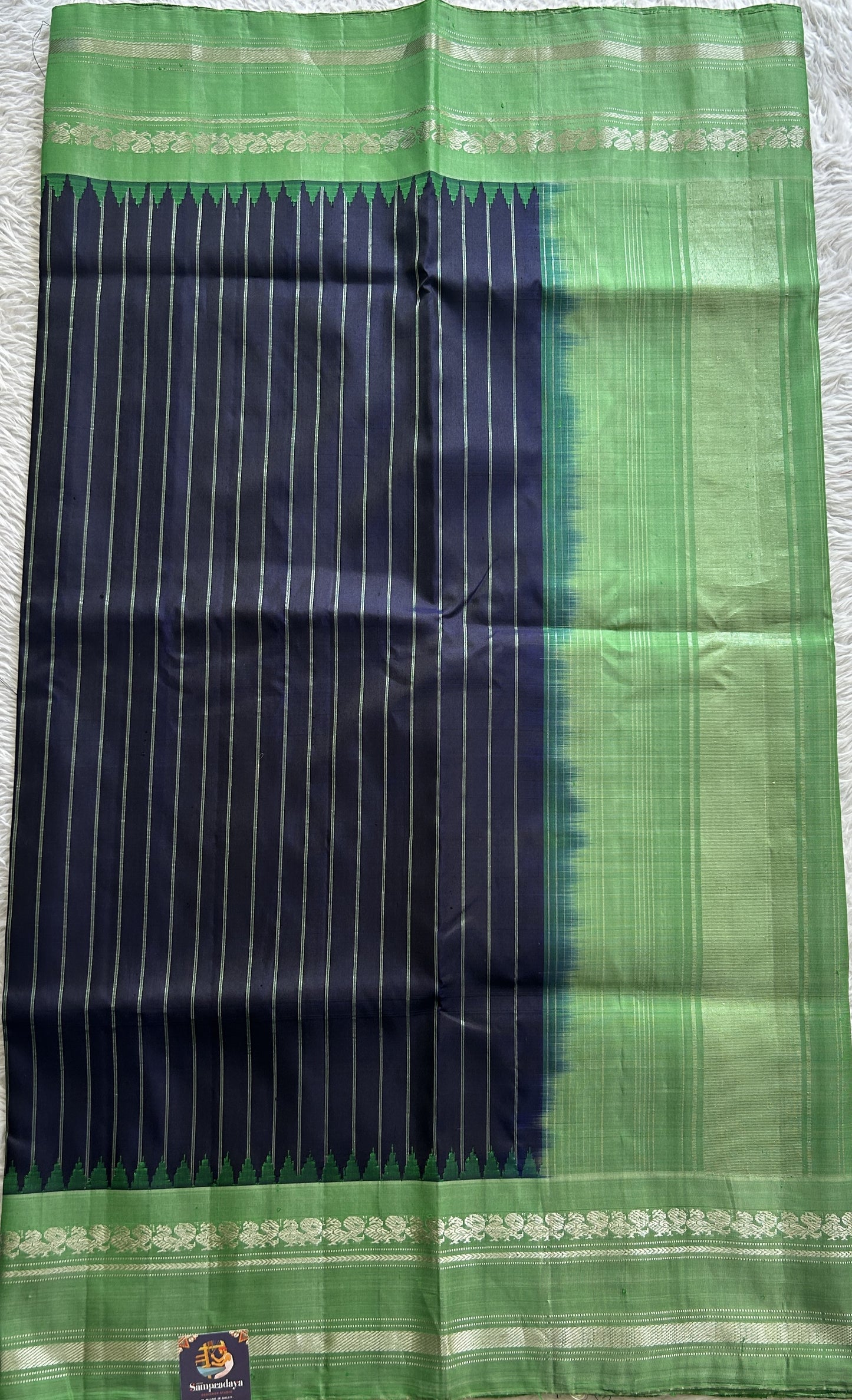 Gadwal Pattu Saree Navy Blue Colored Complemented With a Green Color Zari Gap Border - Sampradaya Designer Studio