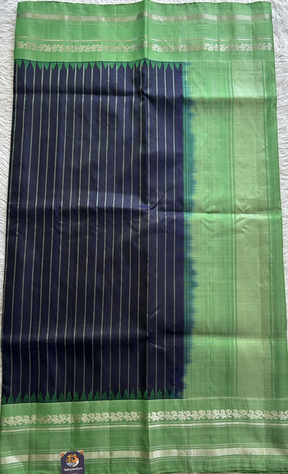 Gadwal Pattu Saree Navy Blue Colored Complemented With a Green Color Zari Gap Border - Sampradaya Designer Studio