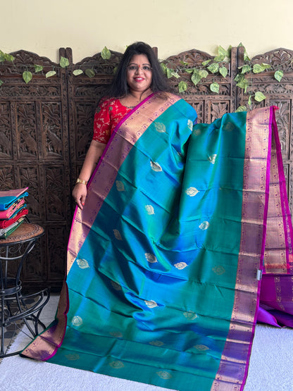 Pure Kanjivaram Silk Saree Light Peacock Green Colored Elegantly Paid with a Gold Zari Border