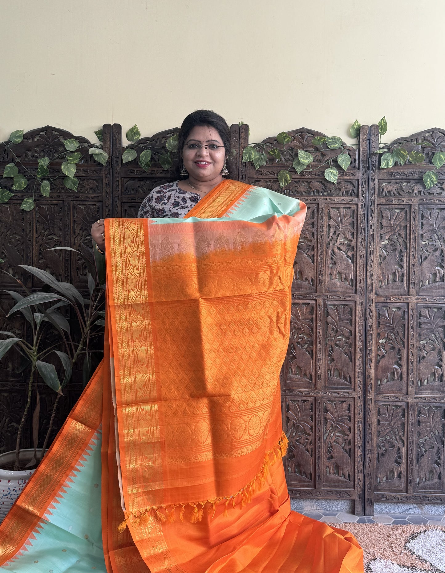 Gadwal Silk Saree Sea Green Colored Complemented With a Orange Zari Border - Sampradaya Designer Studio
