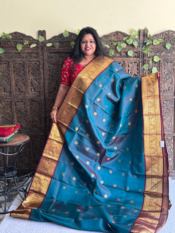 Pure Kanjivaram Silk Saree Peacock Blue Colored Elegantly Paid with a Gold Zari Border - Sampradaya Designer Studio