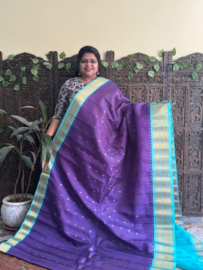 Gadwal Silk Saree Violet Colored Complemented With a Sea Blue Zari Border - Sampradaya Designer Studio