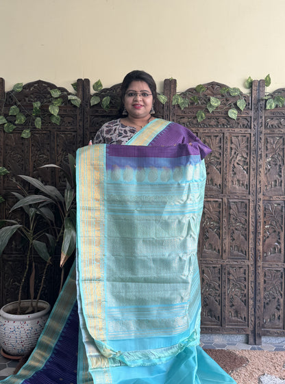 Gadwal Silk Saree Violet Colored Complemented With a Sea Blue Zari Border - Sampradaya Designer Studio