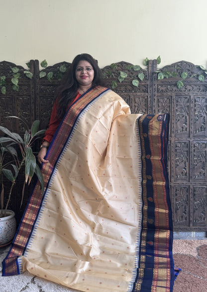Gadwal Pattu Saree Cream colored saree complemented with a Ink Blue Zari border - Sampradaya Designer Studio