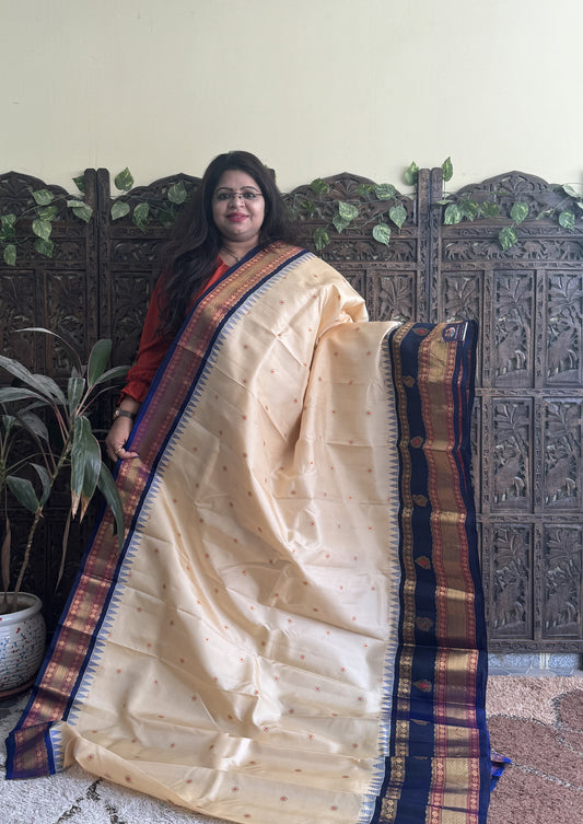 Gadwal Pattu Saree Cream colored saree complemented with a Ink Blue Zari border - Sampradaya Designer Studio