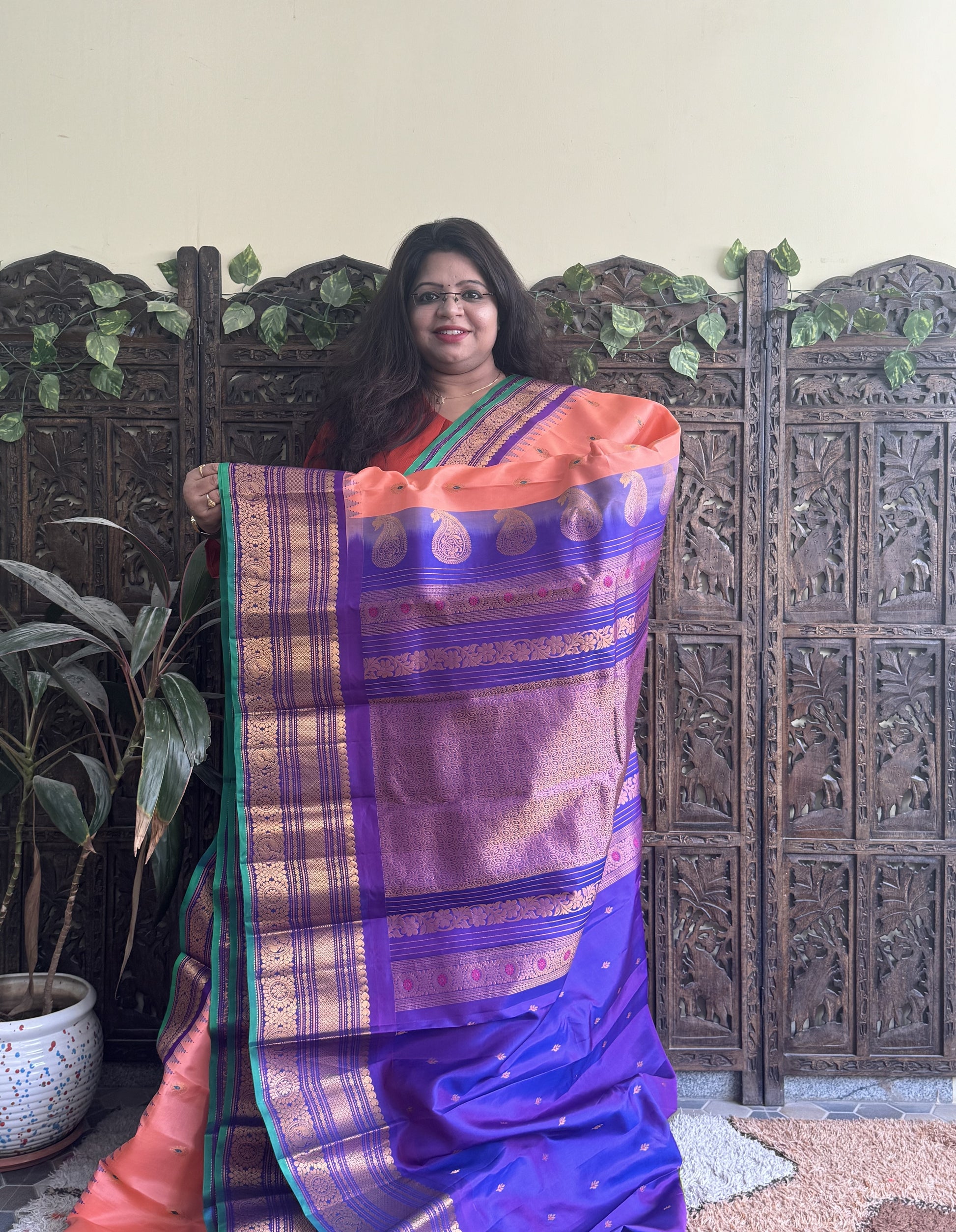 Gadwal Pattu Saree Peach colored saree complemented with a Purple Zari border - Sampradaya Designer Studio
