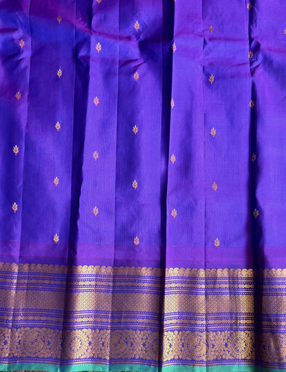 Gadwal Pattu Saree Peach colored saree complemented with a Purple Zari border - Sampradaya Designer Studio