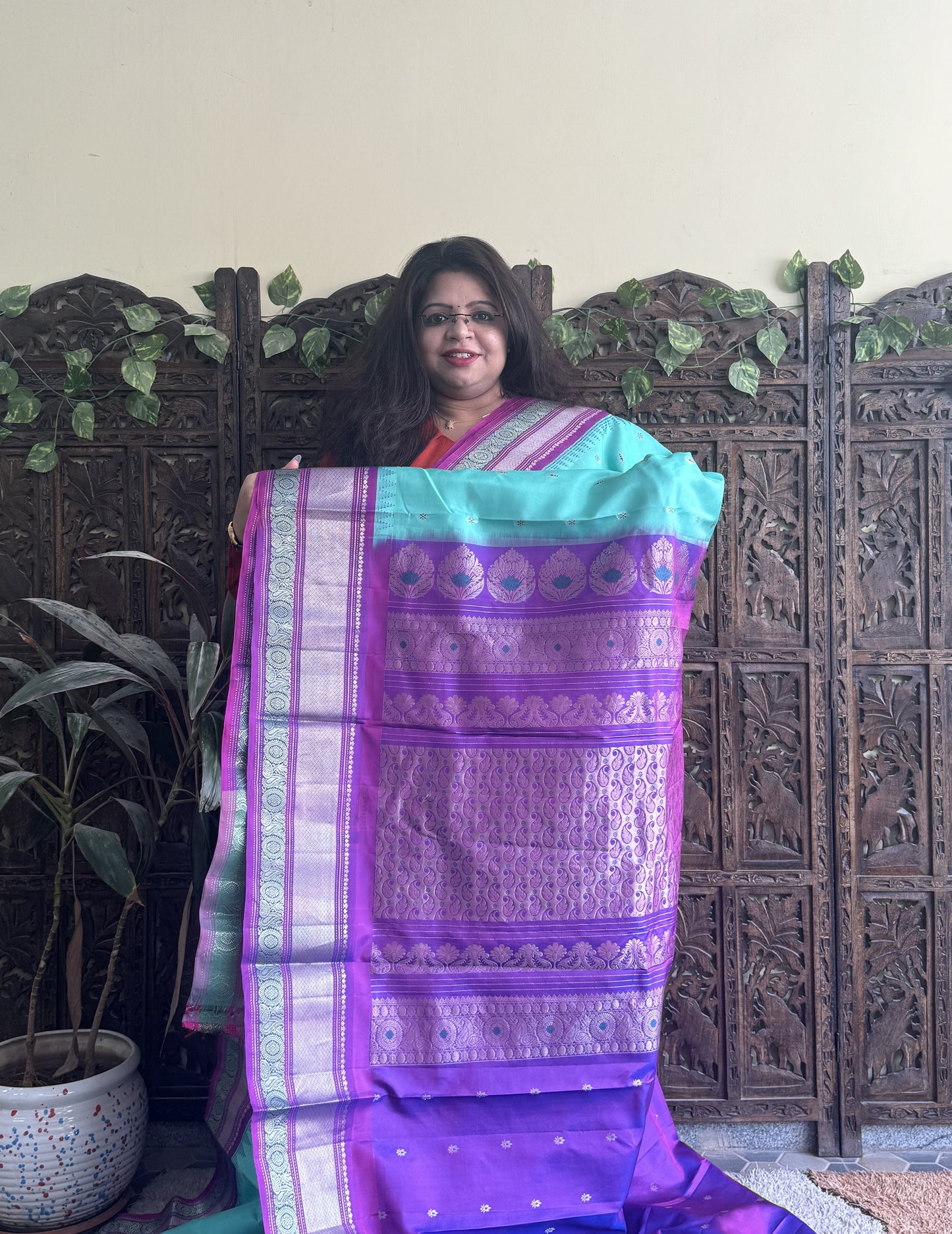 Gadwal Pattu Saree Cyan colored saree complemented with a Purple Zari border - Sampradaya Designer Studio