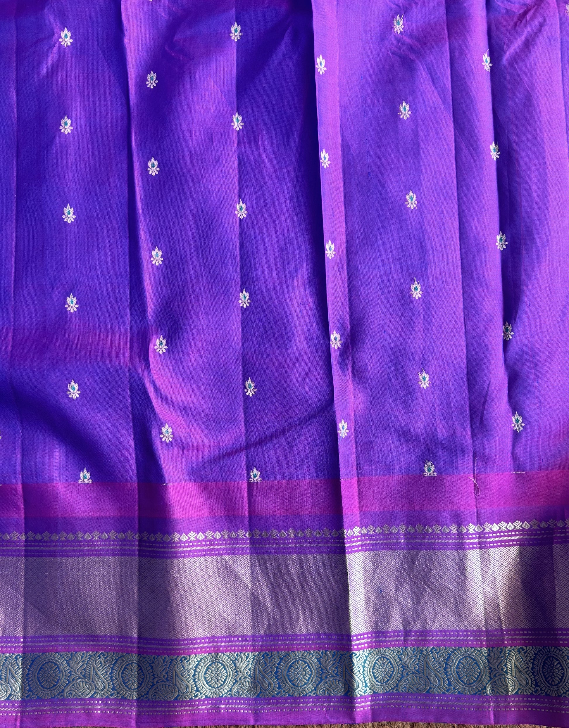 Gadwal Pattu Saree Cyan colored saree complemented with a Purple Zari border - Sampradaya Designer Studio