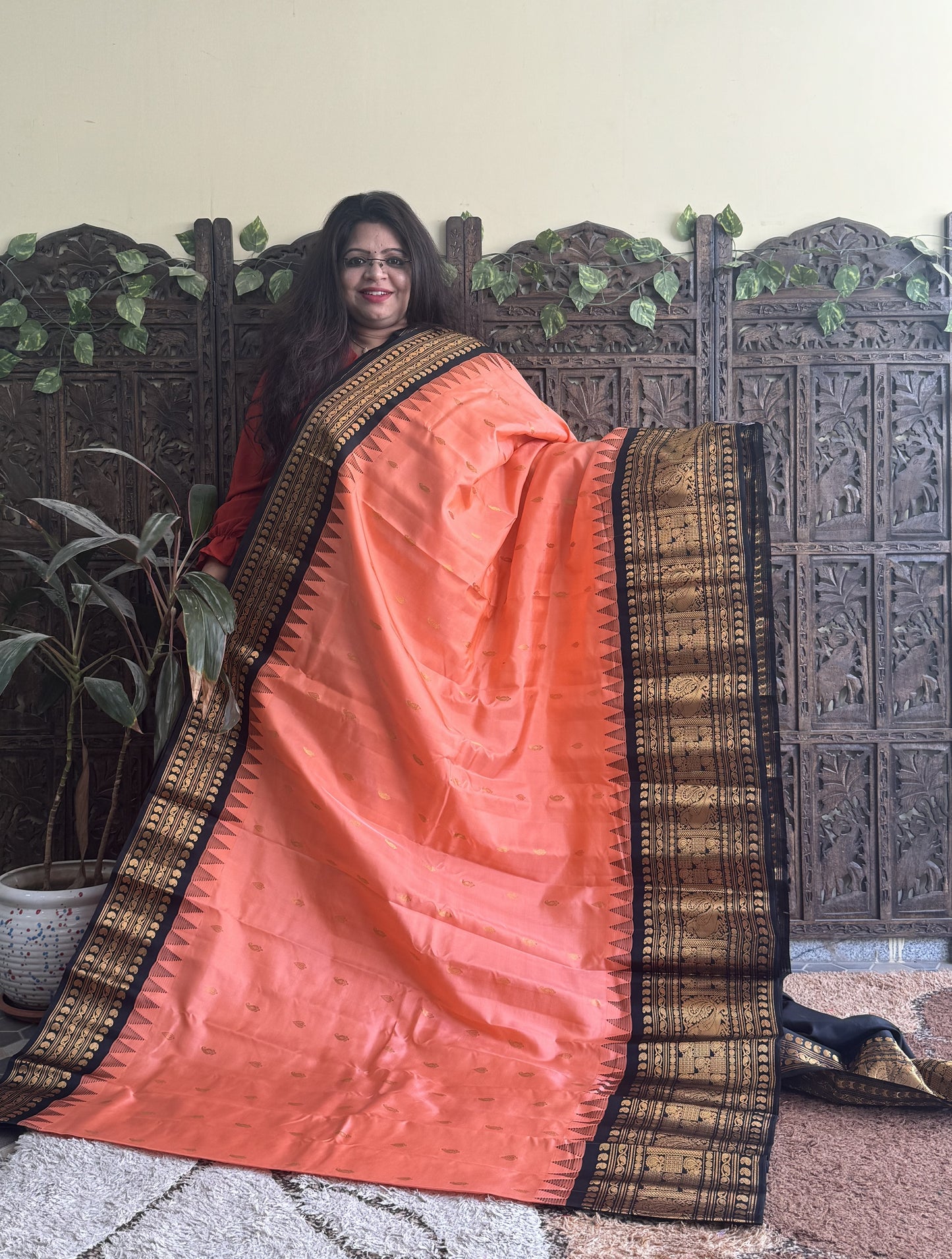 Gadwal Pattu Saree Peach colored saree complemented with a Black Zari border - Sampradaya Designer Studio