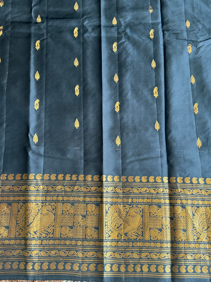 Gadwal Pattu Saree Peach colored saree complemented with a Black Zari border - Sampradaya Designer Studio