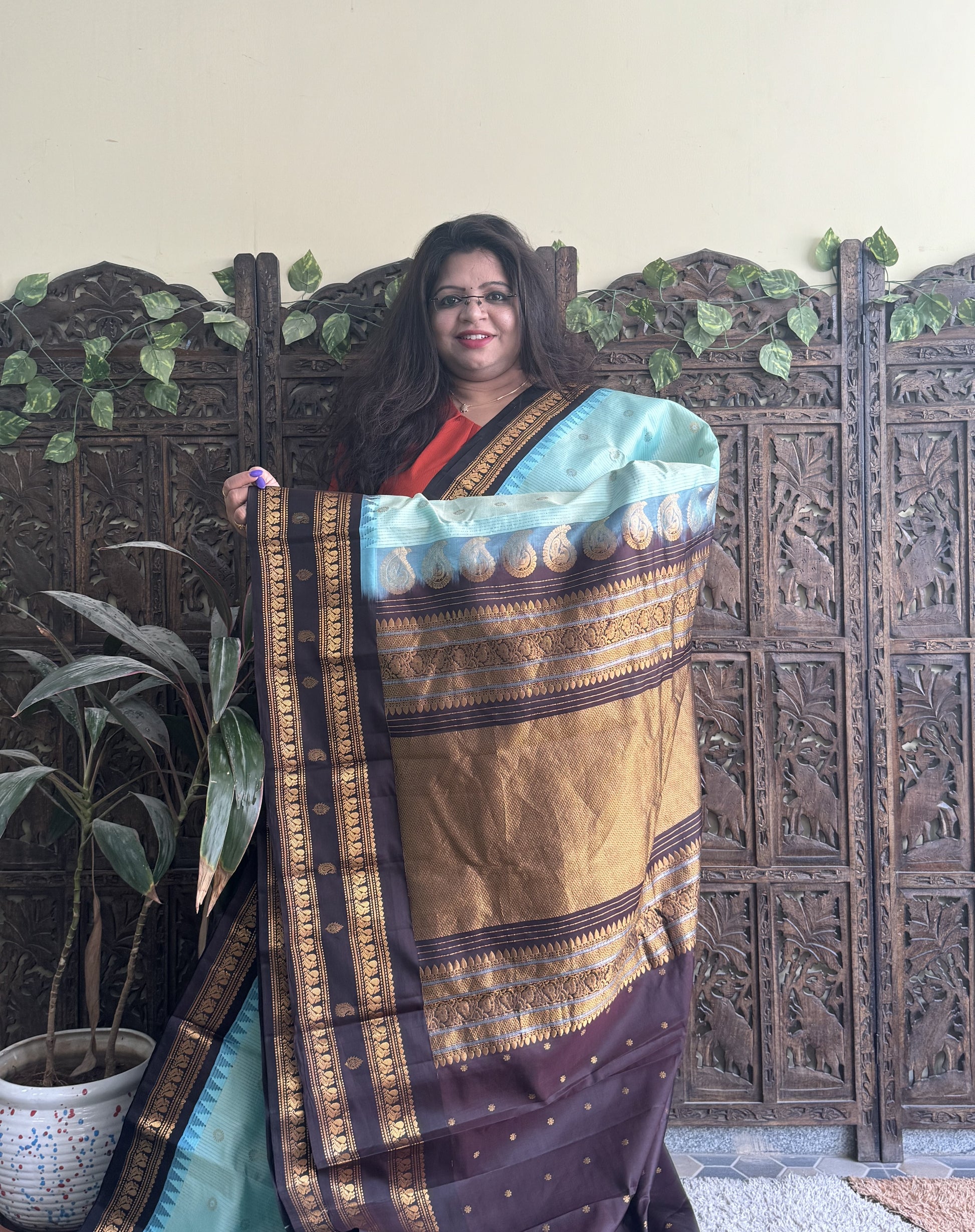 Gadwal Pattu Saree Aqua Blue colored saree complemented with a Brown Zari border - Sampradaya Designer Studio