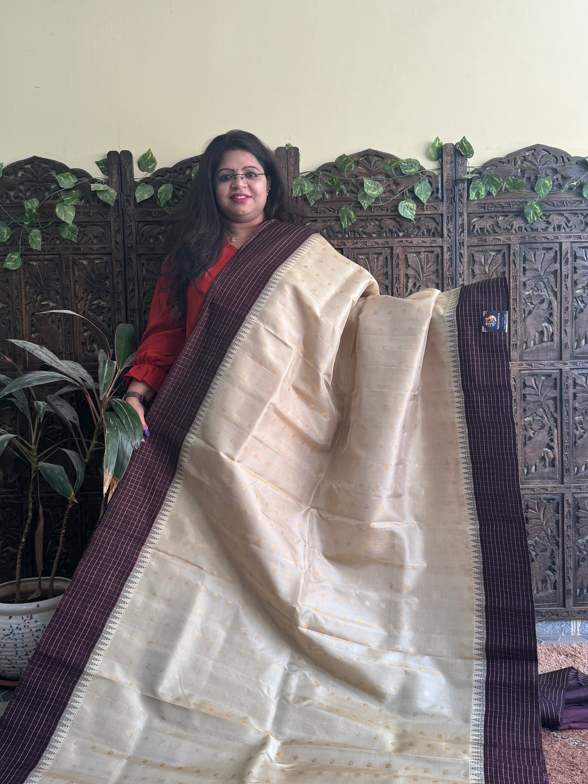 Gadwal Pattu Saree Cream colored saree complemented with a Brown Checks border - Sampradaya Designer Studio