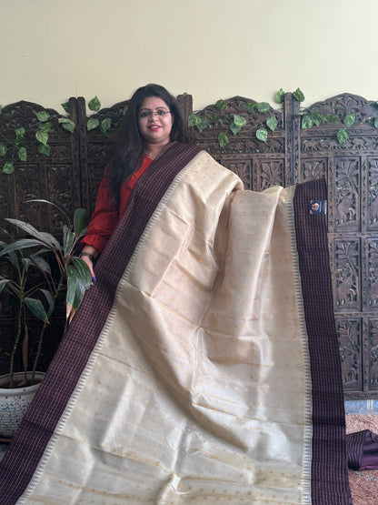 Gadwal Pattu Saree Cream colored saree complemented with a Brown Checks border - Sampradaya Designer Studio