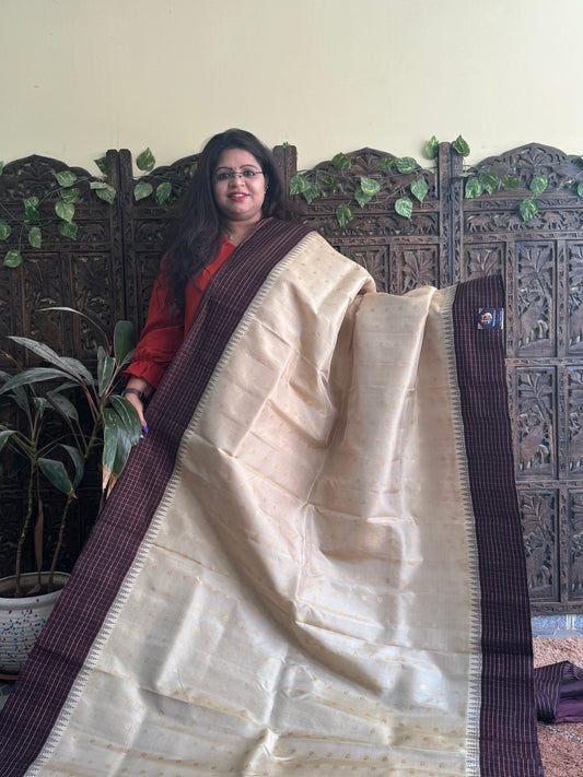 Gadwal Pattu Saree Cream colored saree complemented with a Brown Checks border - Sampradaya Designer Studio