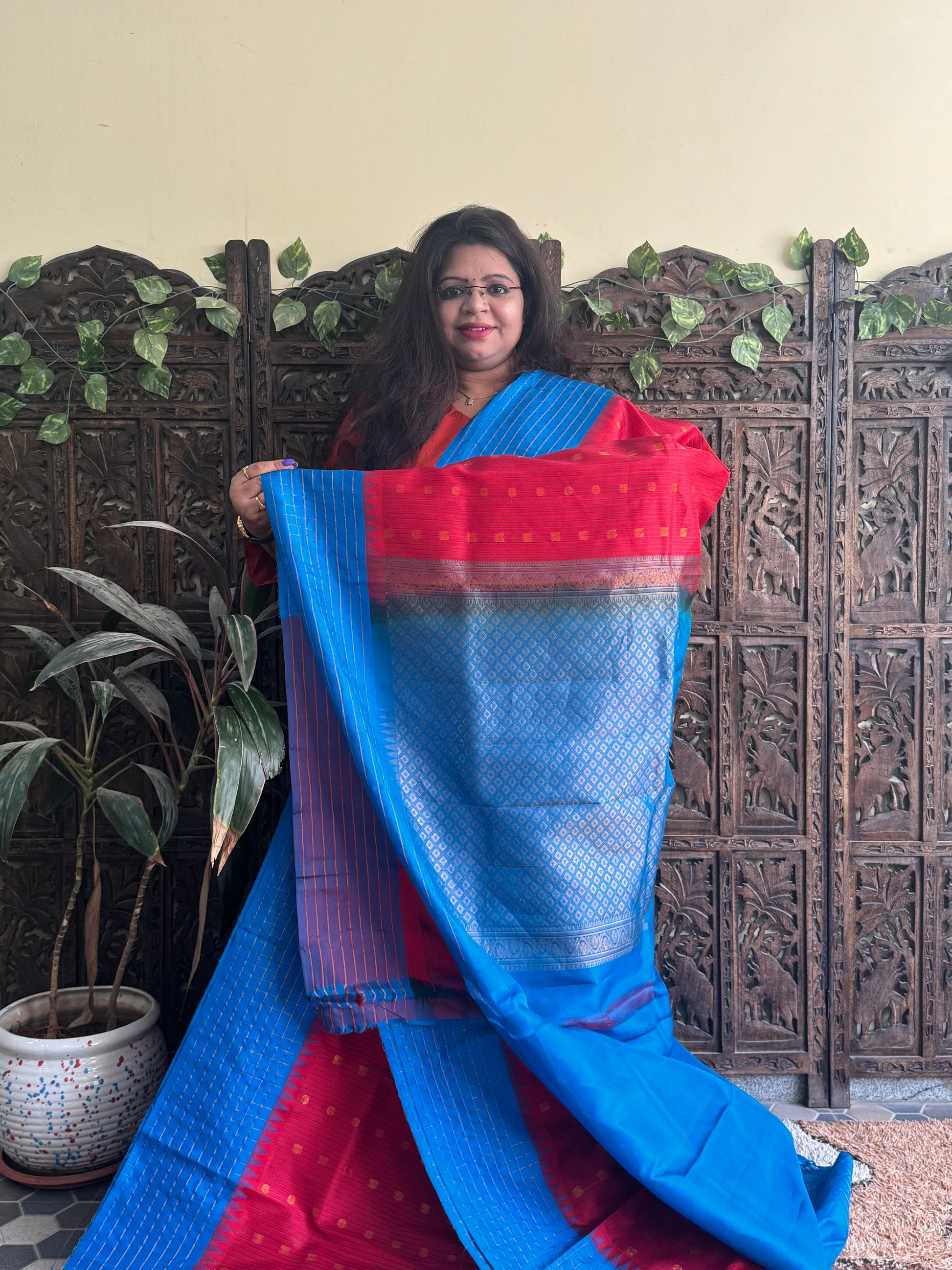 Gadwal Pattu Saree Red colored saree complemented with a Blue Checks border - Sampradaya Designer Studio