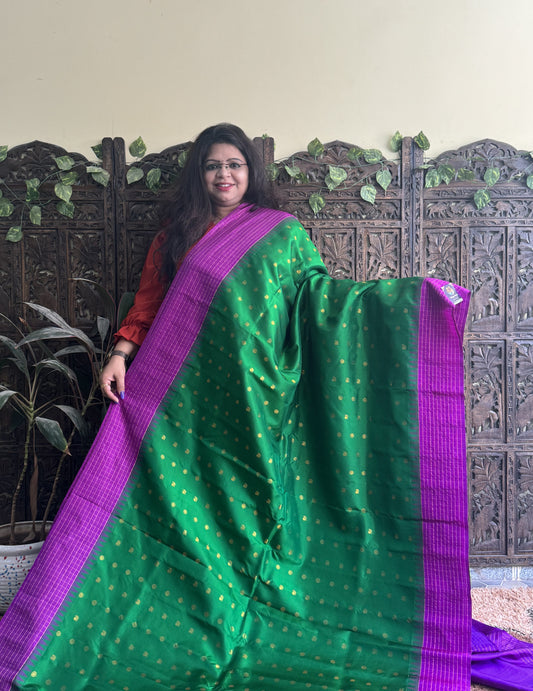 Gadwal Pattu Saree Green colored saree complemented with a Purple Checks border - Sampradaya Designer Studio