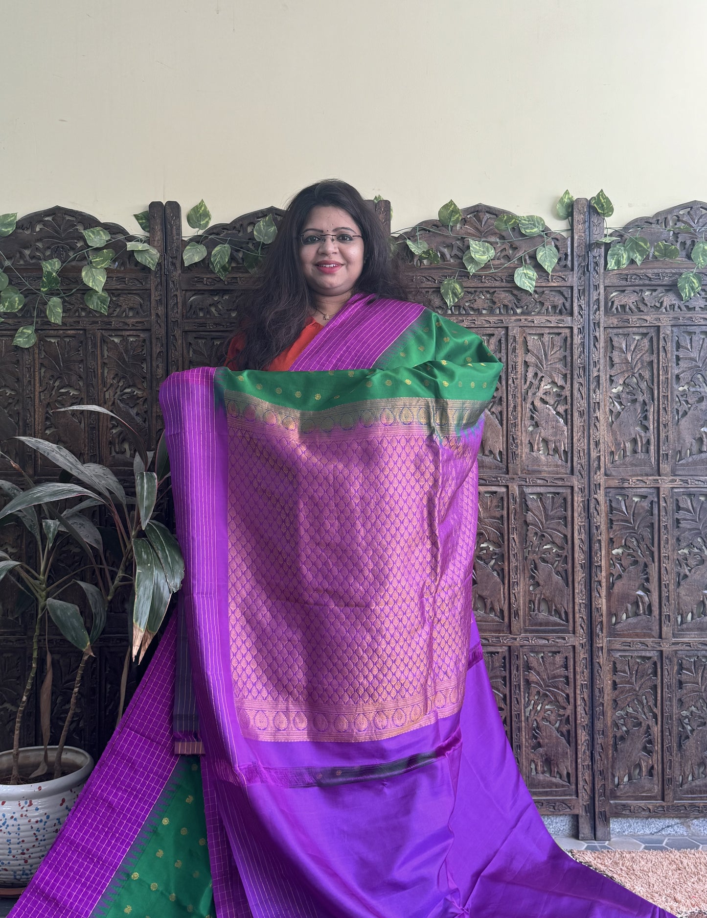Gadwal Pattu Saree Green colored saree complemented with a Purple Checks border - Sampradaya Designer Studio