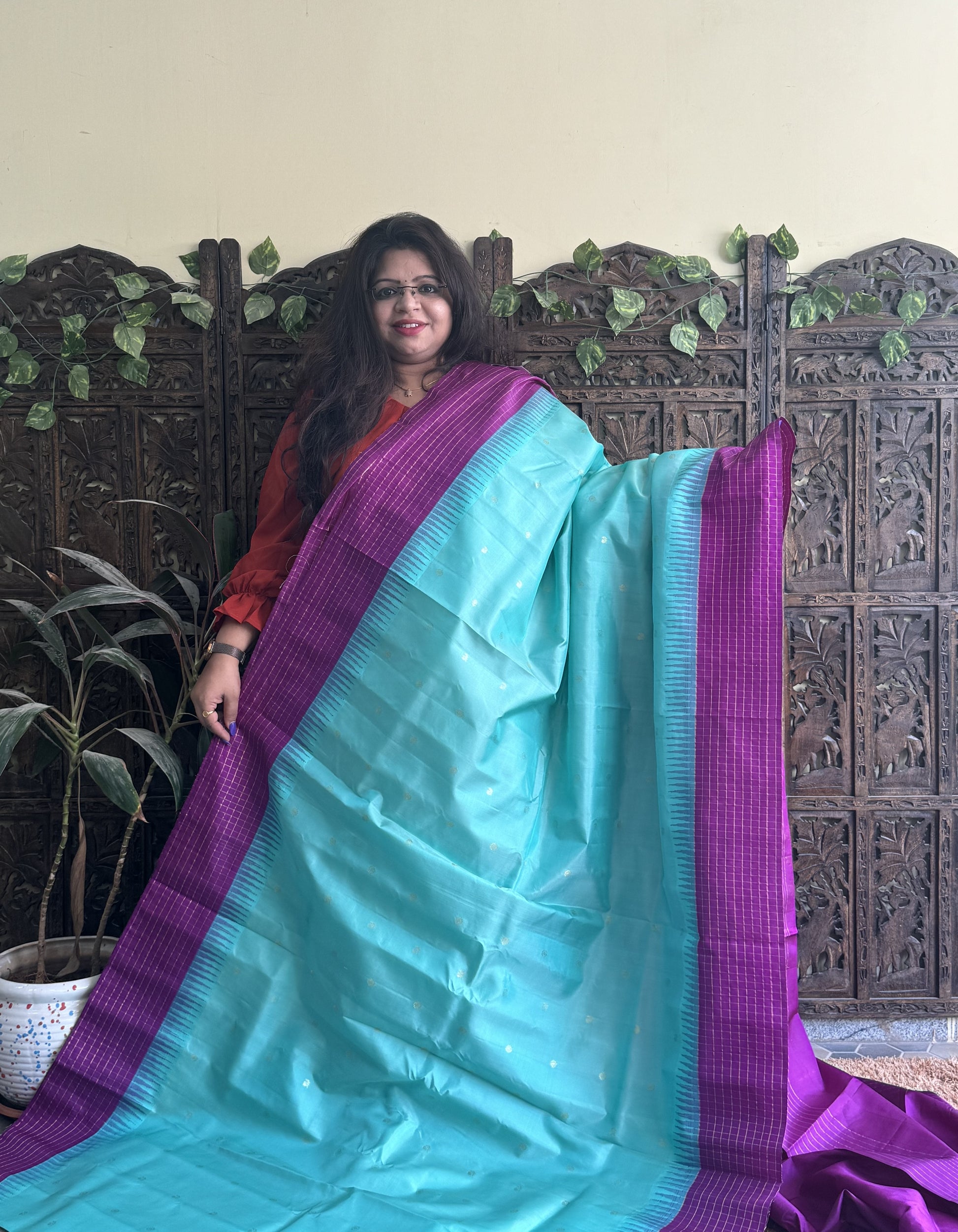 Gadwal Pattu Saree Light Turquoise Blue colored saree complemented with a Purple Checks border - Sampradaya Designer Studio