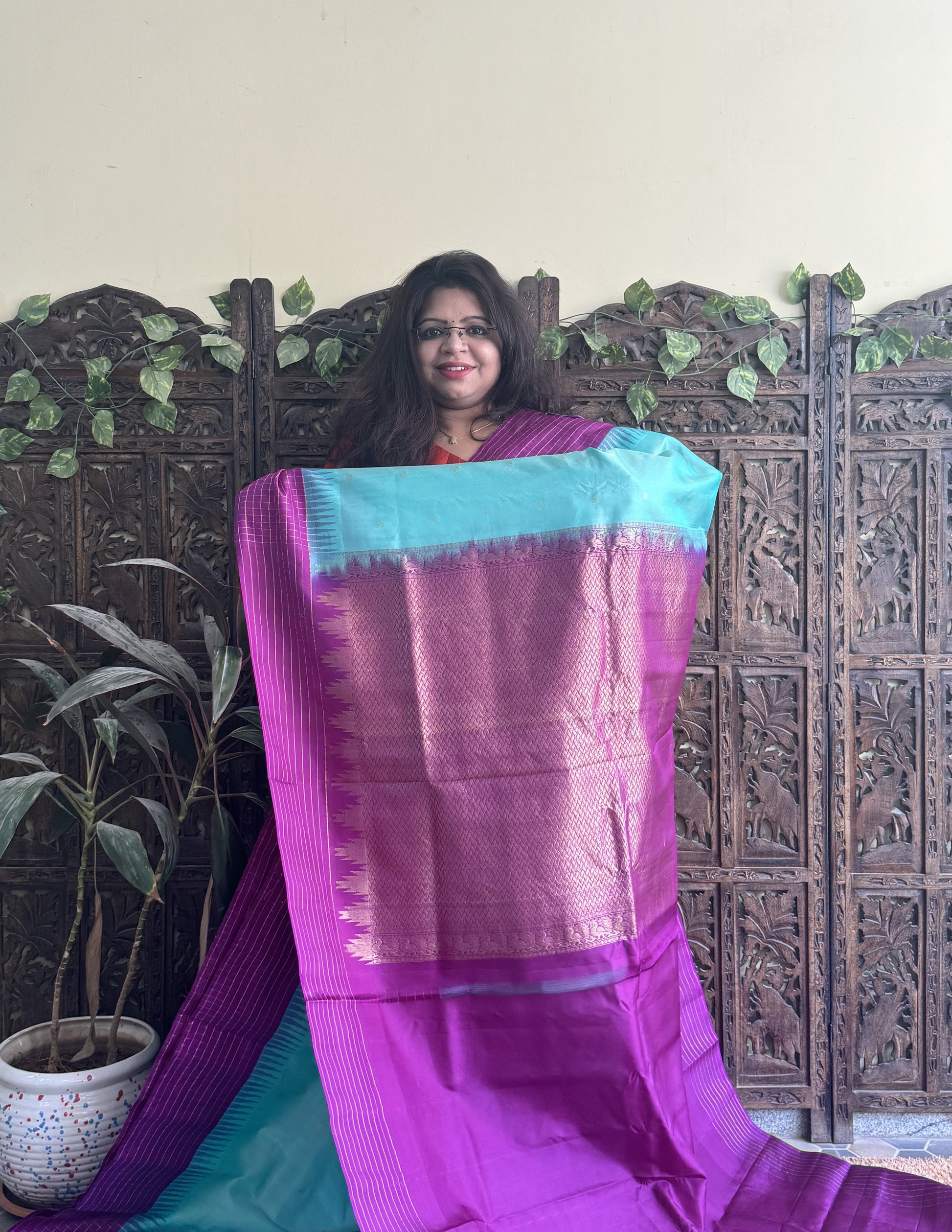 Gadwal Pattu Saree Light Turquoise Blue colored saree complemented with a Purple Checks border - Sampradaya Designer Studio