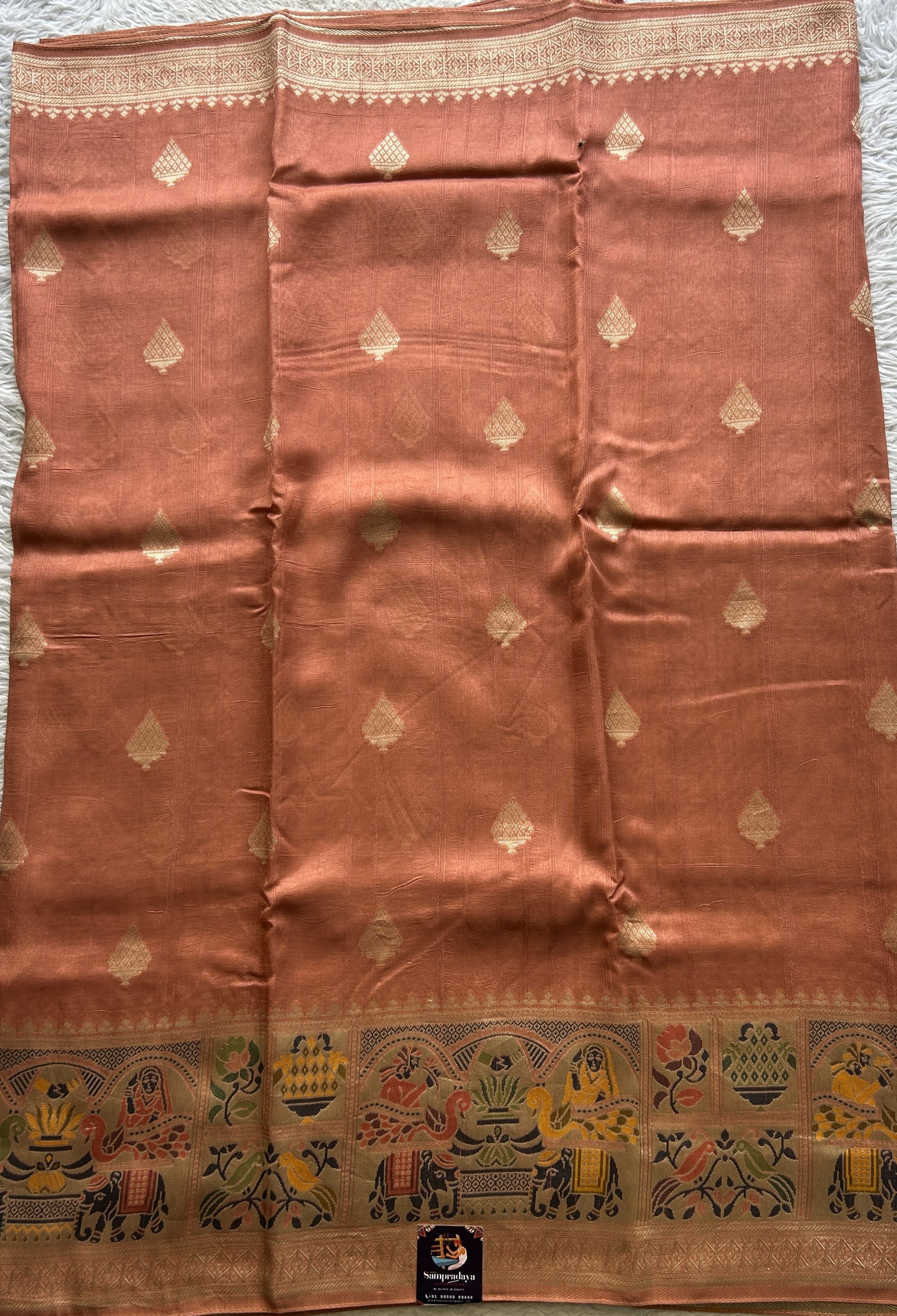 Banarasi Tussar Georgette Saree Peach Colored Exquisite Minakari Border. - Sampradaya Designer Studio
