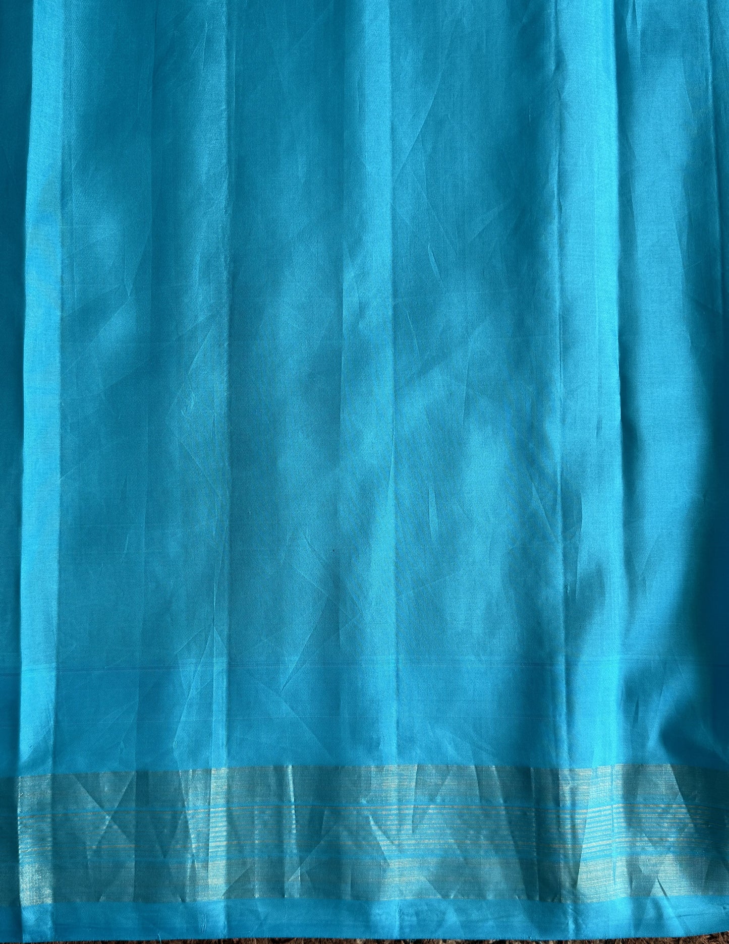 Gadwal Pattu Saree Soft Olive colored saree complemented with a Sky Blue Zari border - Sampradaya Designer Studio