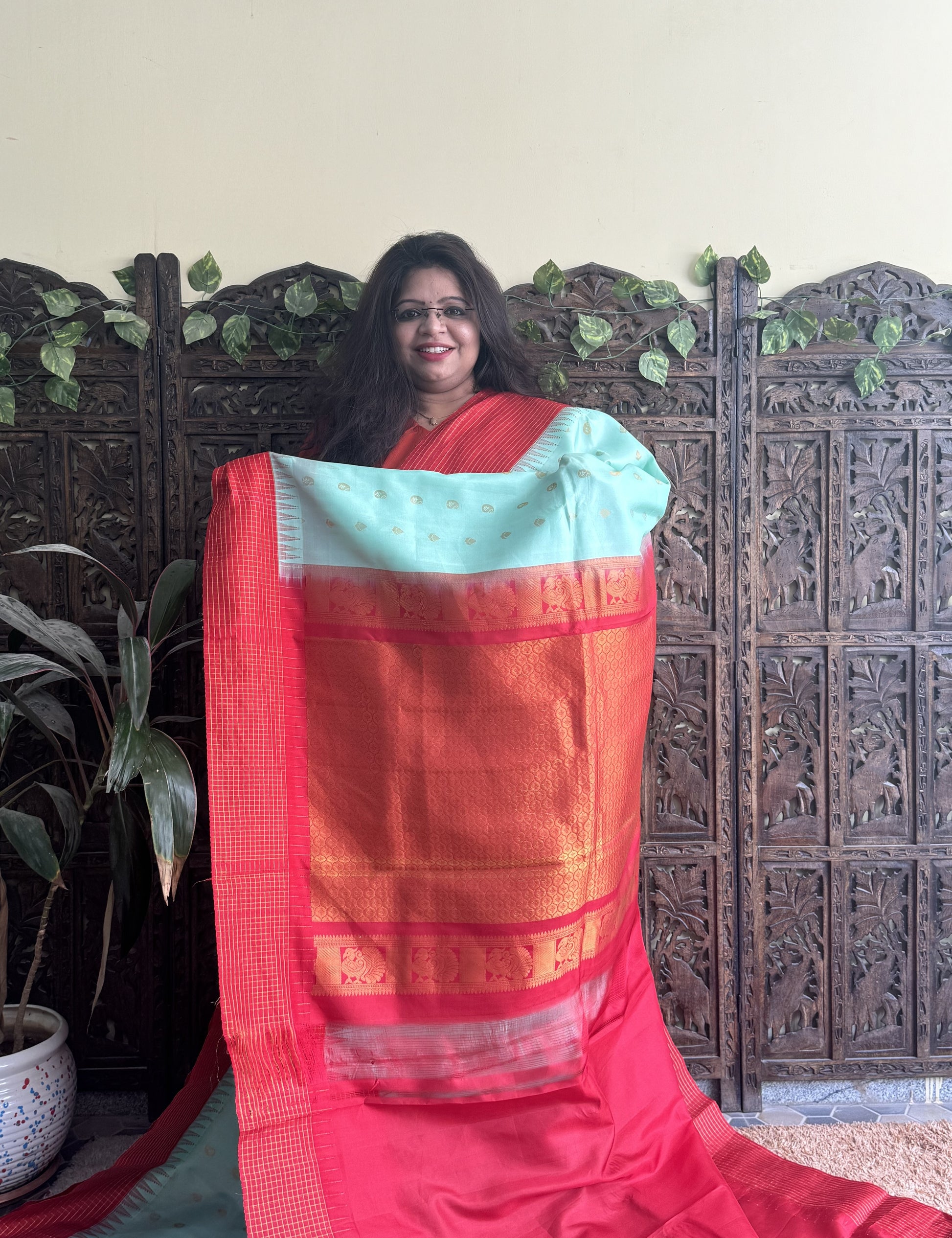 Gadwal Pattu Saree Sea Green colored saree complemented with a Red Checks border - Sampradaya Designer Studio