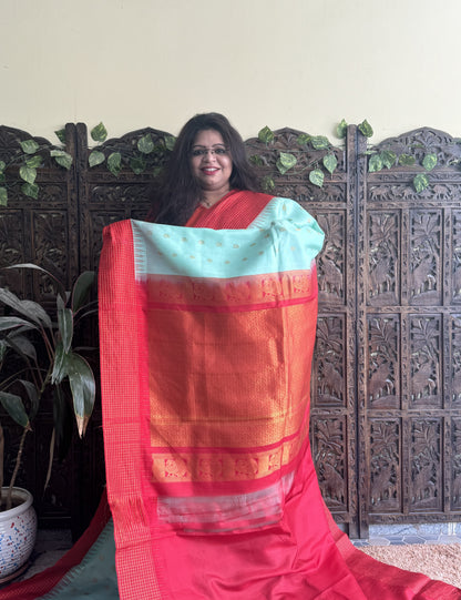 Gadwal Pattu Saree Sea Green colored saree complemented with a Red Checks border - Sampradaya Designer Studio