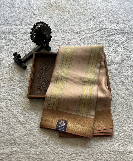 Pure Banarasi Crepe Silk Saree Melon Colored Complemented with a Zari border. - Sampradaya Designer Studio