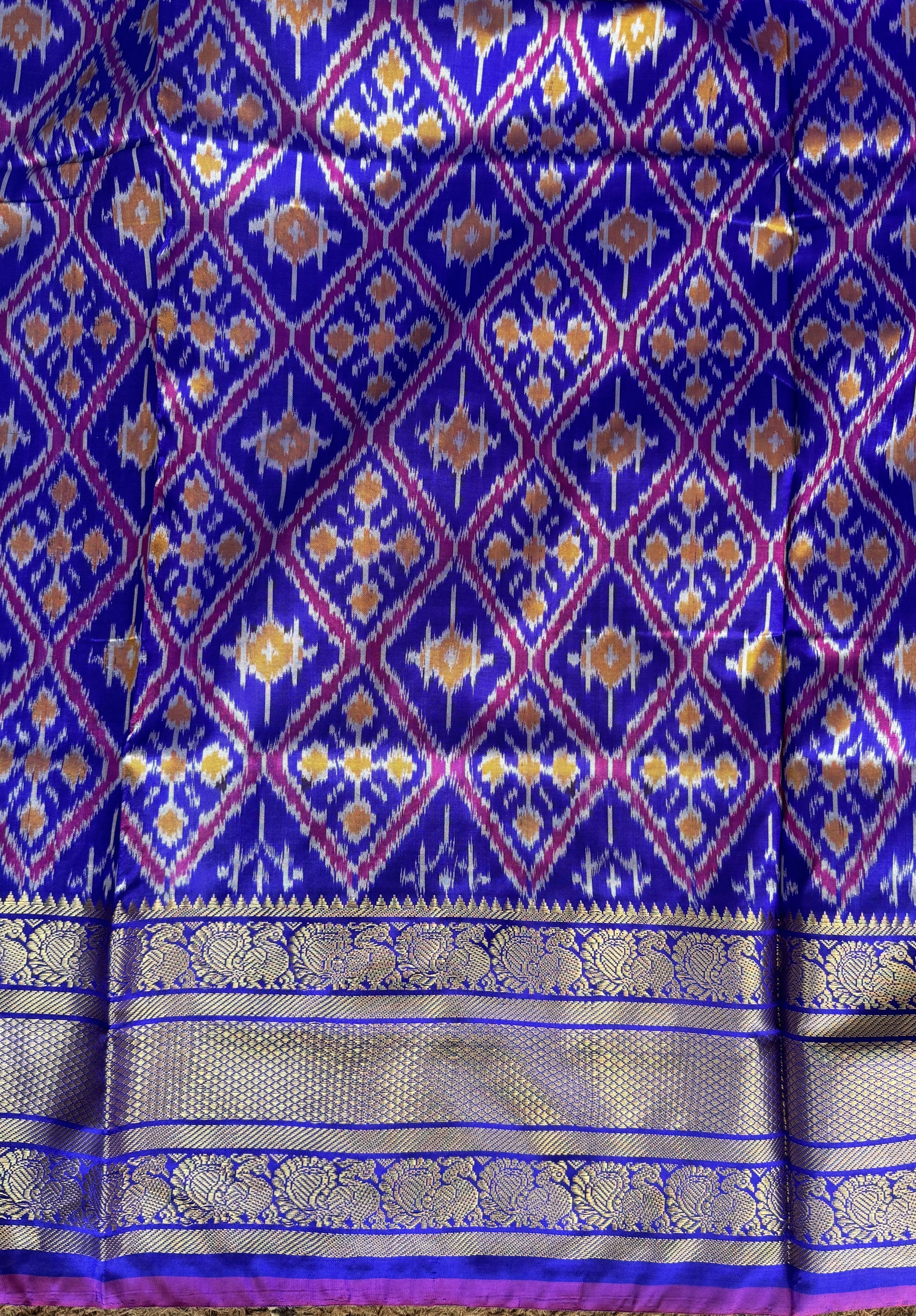 Ikkat Pattu Saree Royal Blue colored complemented with a Kanchi border. - Sampradaya Designer Studio