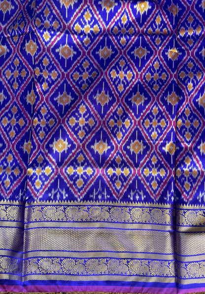 Ikkat Pattu Saree Royal Blue colored complemented with a Kanchi border. - Sampradaya Designer Studio