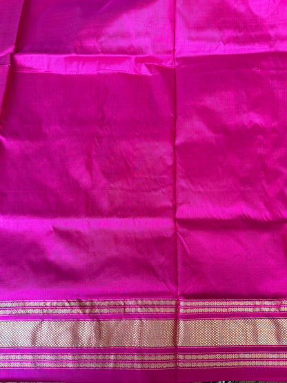 Ikkat Pattu Saree Onion Pink colored complemented with a Kanchi border. - Sampradaya Designer Studio