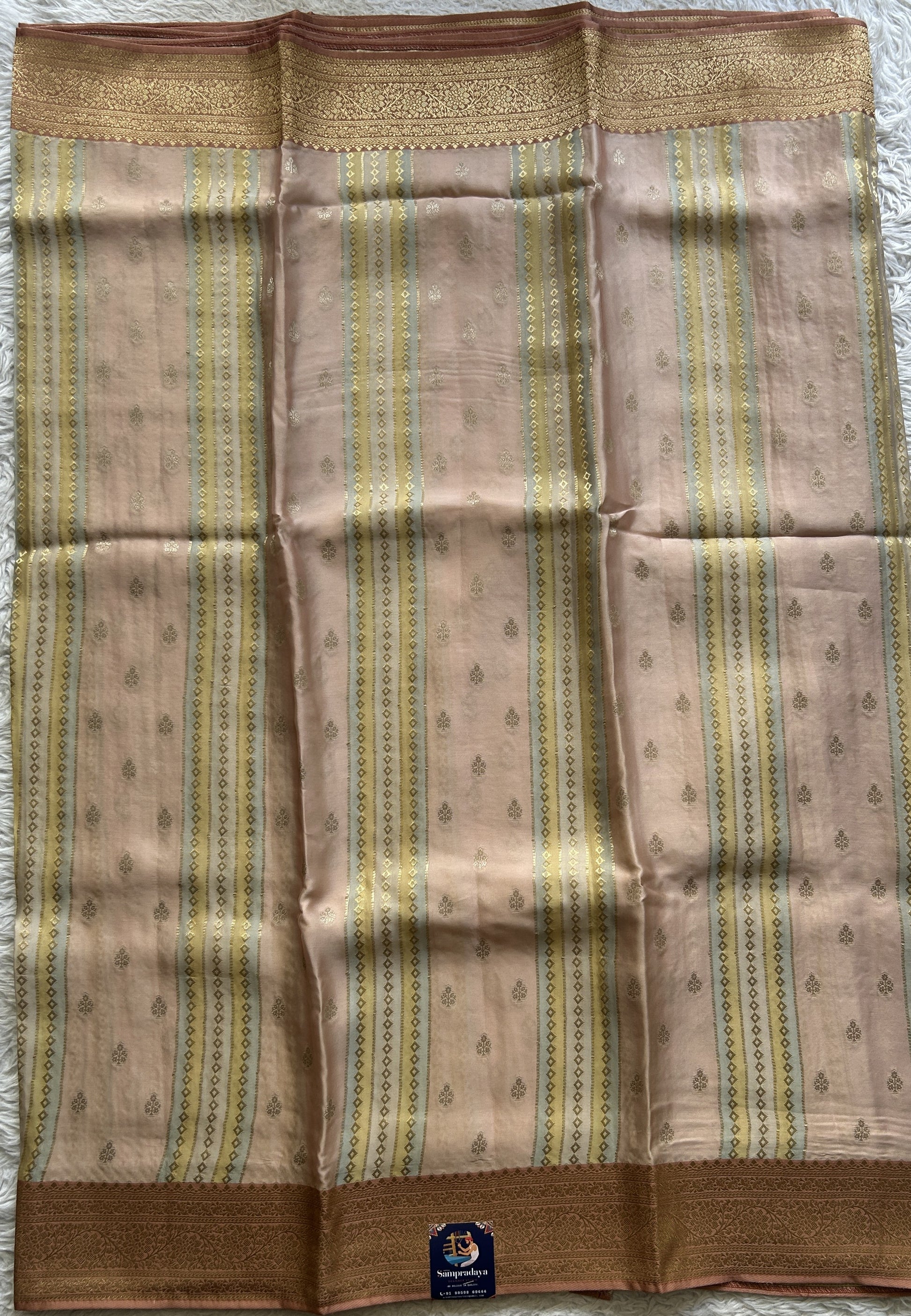 Pure Banarasi Crepe Silk Saree Melon Colored Complemented with a Zari border. - Sampradaya Designer Studio