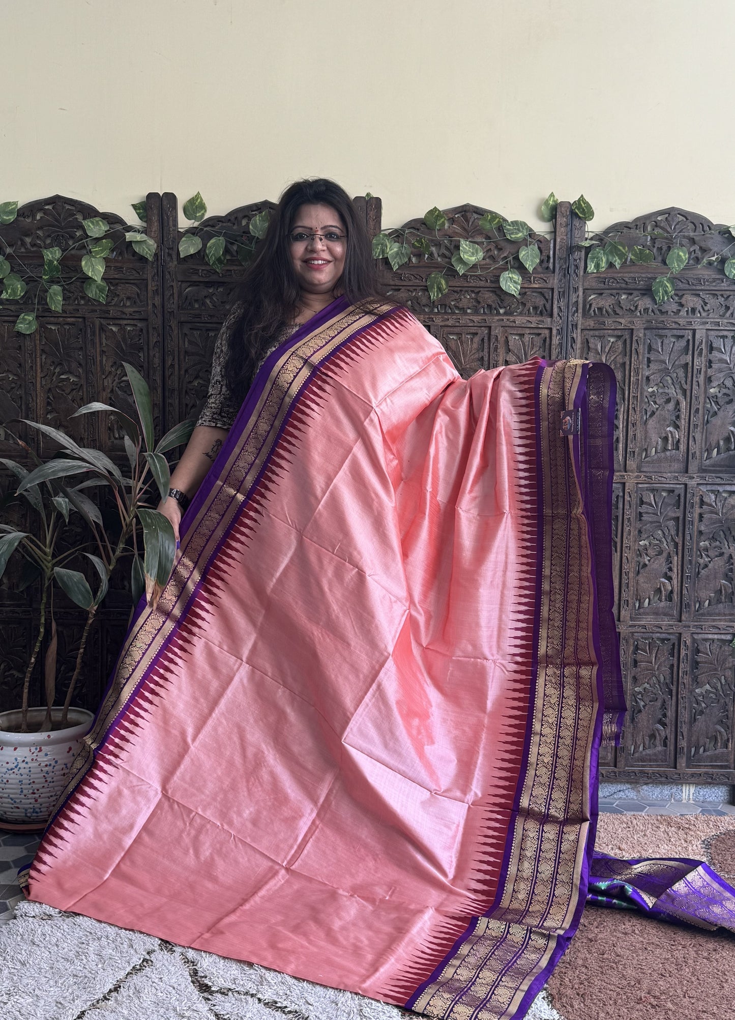 Ikkat Pattu Saree Peachish Pink colored complemented with a Kanchi border. - Sampradaya Designer Studio
