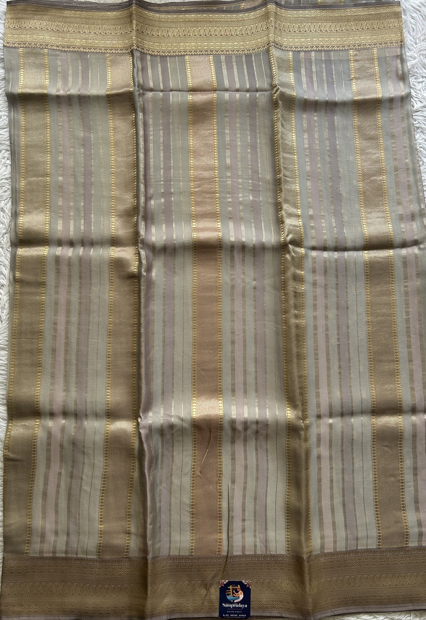 Pure Banarasi Crepe Silk Saree Light Gray Colored Complemented with a Zari border. - Sampradaya Designer Studio