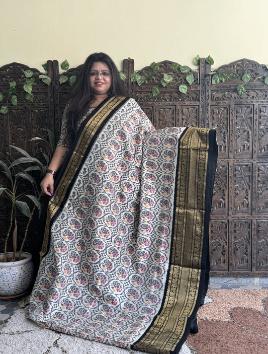 Ikkat Pattu Saree Off White colored complemented with a Kanchi border. - Sampradaya Designer Studio