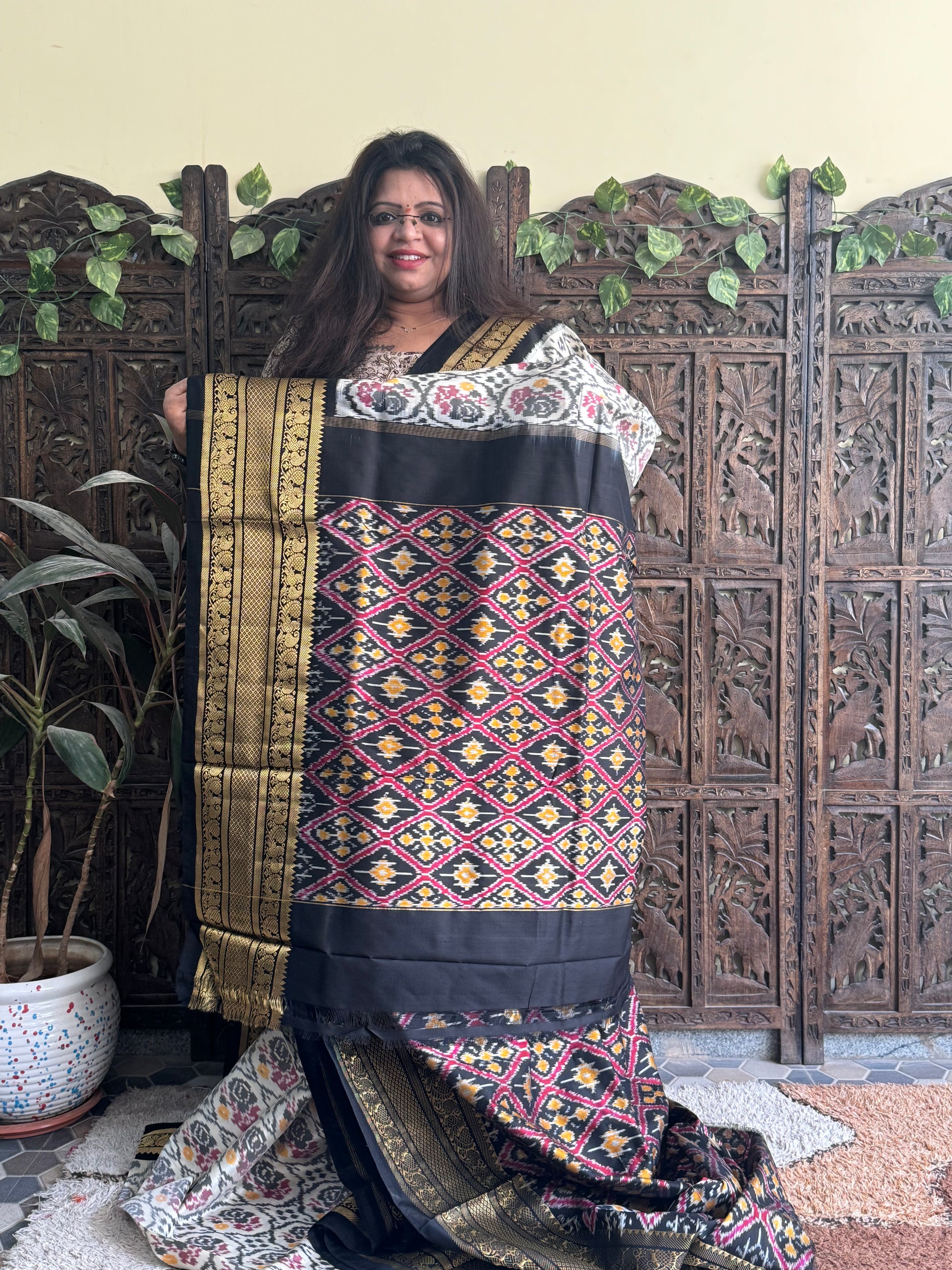 Ikkat Pattu Saree Off White colored complemented with a Kanchi border. - Sampradaya Designer Studio